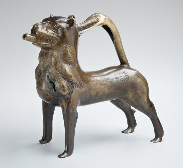 Aquamanile (Handwashing Vessel), Northern Germany, late 12th century with later inscription, copper alloy: cast and engraved, 9 1/2 × 10 7/8 × 4 1/4 in. (24.1 × 27.6 × 10.8 cm), The Jewish Museum, New York, Purchase: The Kagan-Katz-Kivel Families Gift, by exchange; Traditional Judaica Acquisitions Committee and Endowment Interest Funds; Henry and Lucy Moses Fund; Henry Herzog Family and Friends Fund in memory of Ruth Herzog; Helen and Jack Cytryn Fund; and Traditional Judaica Acquisitions Fund, 2013.