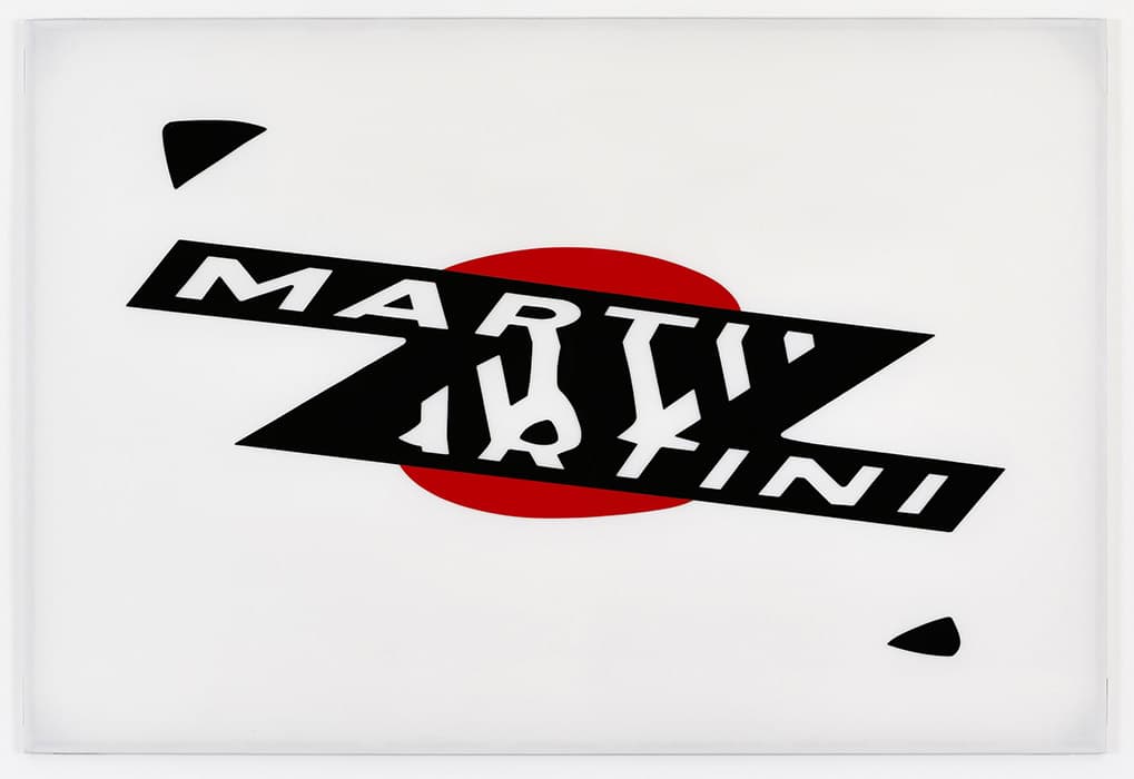 G EXHIBITIONS, ADVERTISING, GRANDVILLE 

Raymond Hains, Martini, 1968
Plexiglas relief
Estate of Raymond Hains, courtesy of Galerie Max Hetzler, Paris and Berlin

The Marxist concept of commodity fetishism describes the way in which, under capitalism, objects become unmoored from their relationships to real human needs and acquire an almost magical power to command desire. In nineteenth-century Paris this commercial culture was clamorous: advertisers jockeyed for the attention of potential buyers, papering over one another’s advertisements before the glue could dry.

The advertising poster, a form that developed rapidly during this time, helped to produce the fetish character of the products it depicted. In this work, Raymond Hains distorts a famous logo, referring unmistakably to the Italian vermouth but undermining the effect of the original with a disorienting twist.