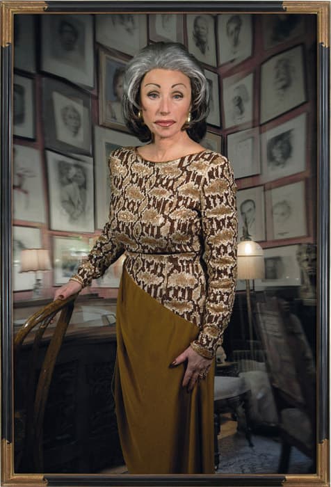 H THE COLLECTOR

Cindy Sherman, Untitled #474, 2008
Chromogenic print
Collection of Cynthia and Abe Steinberger
Courtesy of the artist and Metro Pictures, New York

Benjamin views the flâneur, the gambler, and the collector as emblematic of certain aspects of modern culture. The impulse to collect is an intensified version of the general tendency of the bourgeois citizen to focus on his or her private domestic space, filling it with carefully chosen objects.

In The Arcades Project, Benjamin uses a similar approach to the writing of history, which he describes as ragpicking: he recovers cast-off scraps of information overlooked by historians, weaving them into a text that illuminates a place and time. While the ragpicker gathers the detritus of society and is subject, decisively, to chance, the impetus of the collector is to shape a small world whose contents are entirely within her or his control.

Cindy Sherman’s imaginary collector, portrayed by the artist herself, is ensconced in her study, her chosen objects towering behind her like fortifications. Despite this, like many of Sherman’s characters, she emanates vulnerability.