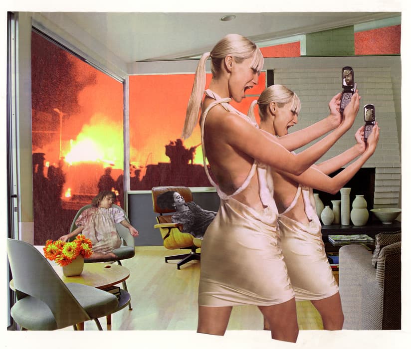 Surreal digital collage showing two women in satin dresses taking selfies with flip phones inside a modern living room, while a fiery riot rages outside and figures sit slumped in the background, creating a stark contrast between chaos and detachment.