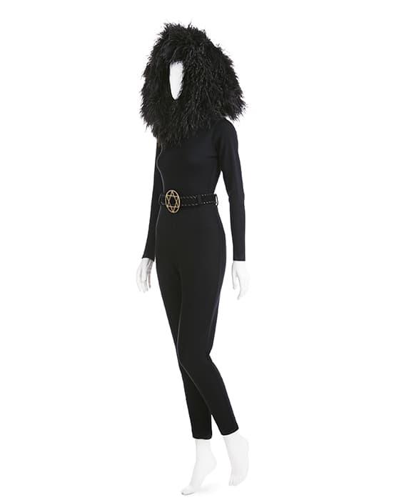 Blackbird, Star of David belt, ostrich-feather hood, stretch wool jersey bodysuit, stretch wool jersey pants, suede and brass belt, fall 1991. Photograph © Jason Frank Rothenberg. Mizrahi irreverently puts symbols to work as part of the religious, political, and cultural mash-up of the fall 1991 collection. “If crosses are everywhere, why not make the Star of David ubiquitous too? Just another thing?”