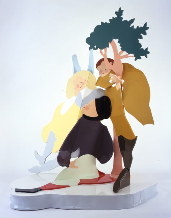 Colorful cut-out sculpture depicting three stylized figures interacting beneath a simplified green tree, with flowing shapes and glossy surfaces on a white base.
