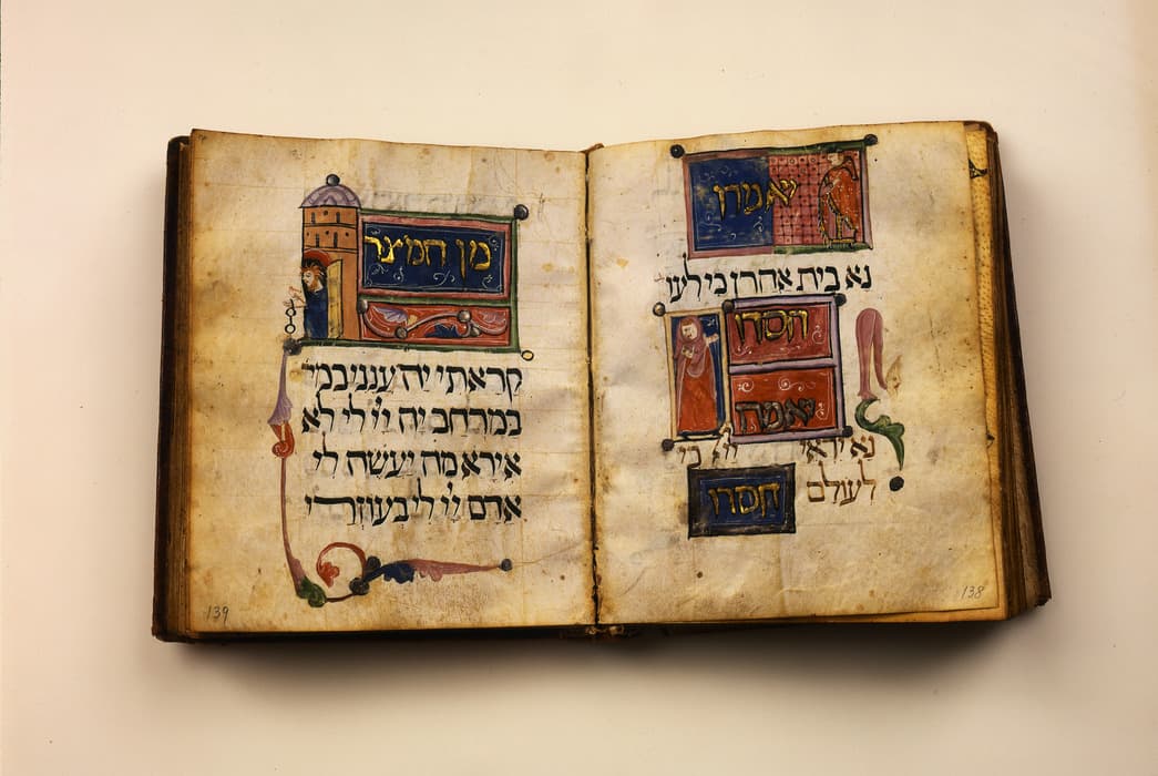 An open illuminated manuscript with Hebrew text on both pages, written in black ink with decorative, colorful illustrations and ornate borders. The left page features a miniature building with a domed roof and a figure looking out from a doorway, along with a panel of gold and blue. The right page contains several rectangular text panels in red, blue, and gold, along with small human figures and decorative flourishes. The parchment pages show signs of aging, with darkened edges and slight wear.