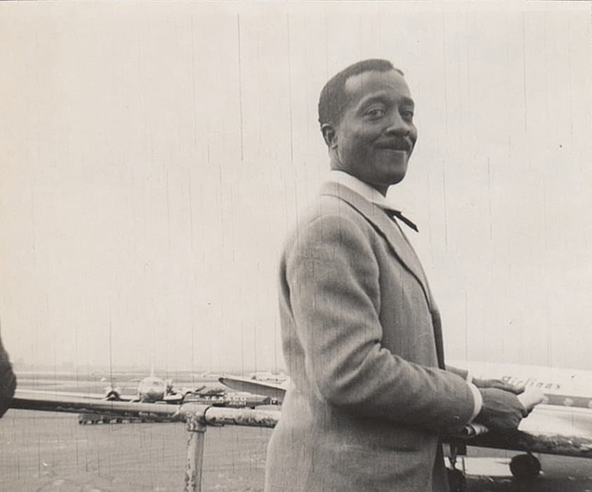 Norman Lewis at LaGuardia Airport, New York, c. 1951, Willard Gallery Archives, courtesy of Miani Johnson.

Lewis smiles for the camera at LaGuardia airport in this picture. It was likely taken by Dan Johnson, husband of Marianne Willard, who owned the Willard Gallery. Lewis was among the other Gallery artists, including Lyonel Feininger, Morris Graves, Mark Tobey, and David Smith, from 1946 until he left the gallery in the early 1960s. Lewis had seven shows at the Willard Gallery between 1949 and 1961. During this period, Lewis spent time with the Willard-Johnsons, often at their home in Locust Valley, New York.