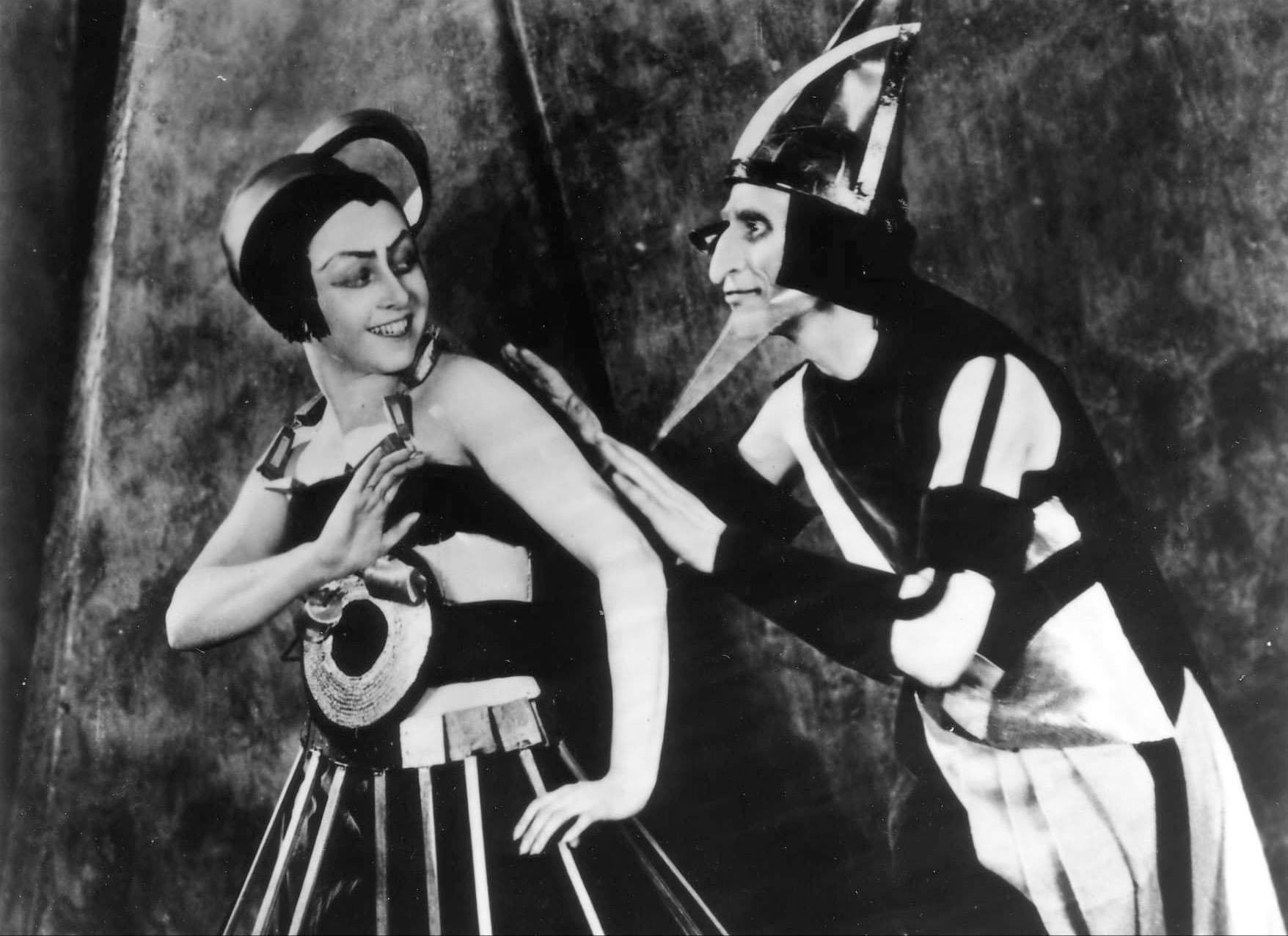 Aelita: Queen of Mars Directed by Yakov Protazanov 1924, USSR, 111 min.

The early Soviet science fiction film Aelita tells the story of Los, an engineer who becomes obsessed with a cryptic radio message from Mars. As he builds a spaceship that will take him to the red planet, he is observed through a giant telescope by the Martian Queen Aelita, daughter of the totalitarian ruler Tuskub. When Los and his companions arrive on Mars, Aelita and Los fall in love. The Russians incite the downtrodden Martian slaves to rise up in rebellion. Aelita at first offers to lead the revolution but then forms her own totalitarian regime. Los, disillusioned, tries to stop her, only to wake up and discover that it was all a dream. Widely acclaimed???if hardly understood???upon its release, the film was eventually banned by Stalin???s censors. Based on a novel by Alexei Tolstoy, it has remarkable Constructivist sets and elaborate costumes for the scenes on Mars, designed by Alexandra Exter.