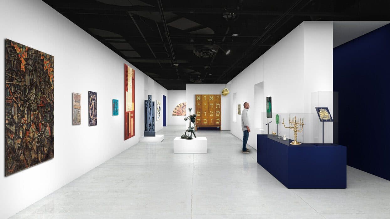 Modern museum gallery with colorful paintings, sculptures, and Judaica objects displayed in glass cases and on pedestals, with a visitor observing an artwork on the right wall.