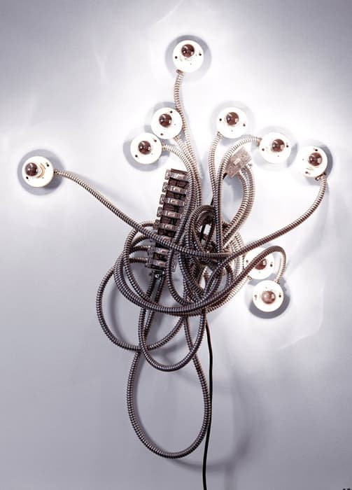 Matthew McCaslin (American, b. 1927), Being the Light. New York, New York, United States, 2000. Light bulbs, porcelain light fixtures, metal electrical conduit, switches, and metal receptacle box. 62 x 44 3/4 x 10 1/2 in. (157.5 x 113.7 x 26.7 cm). The Jewish Museum, New York. Purchase: Contemporary Judaica Acquisitions Committee Fund and Judaica Acquisitions Fund , 2001-14a-j