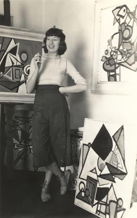 Maurice Berezov. Lee Krasner in the studio, Brooklyn, c. 1940, Copyright A.E. Artworks.

Krasner was born Lena Krassner shortly after her mother and siblings joined her father in America from Russia. She grew up in an Orthodox Jewish home in Brooklyn. English, Hebrew, Yiddish, and Russian were all spoken. Krasner's art education began at Washington Irving High School in Manhattan and continued at the Women's Art School of The Cooper Union — a traditional setting for a rebellious student. In 1937, when Krasner began to study with the German émigré Hans Hofmann at his school in Greenwich Village, she became immersed in painterly experimentation with Cubist methods.