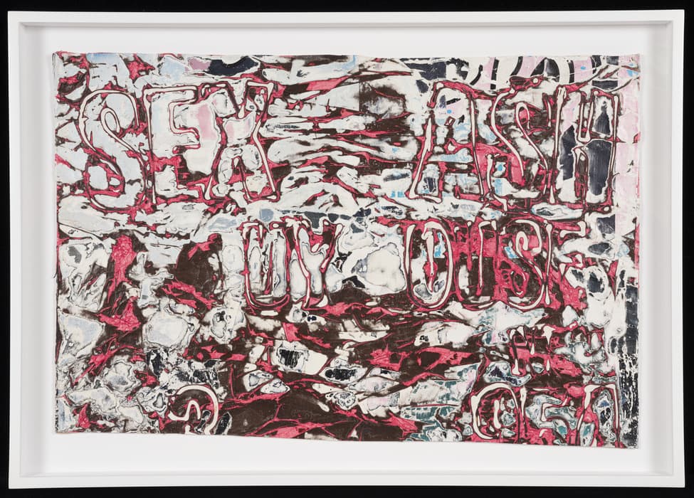 An abstract mixed-media artwork with rough, textured layers of red, white, black, and gray. The surface resembles a chaotic, marbled background with heavy impasto-like textures. Scattered across the piece are partially legible words in large, outlined capital letters, including 