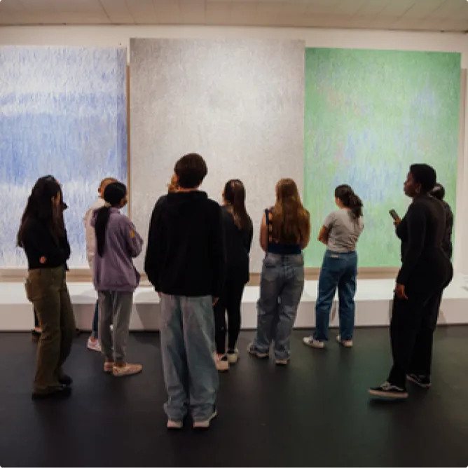 The image captures a group of teens participating in a Teen Art Hang event at The Jewish Museum in New York City