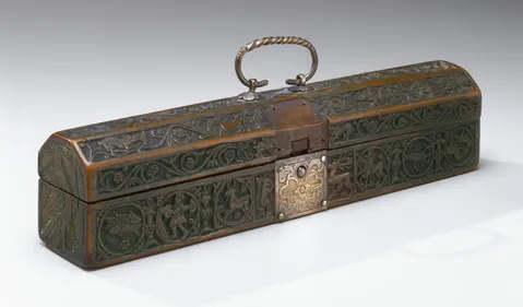 Ornate rectangular Jewish spice container with intricate engraved designs, central clasp, and twisted handle on top.
